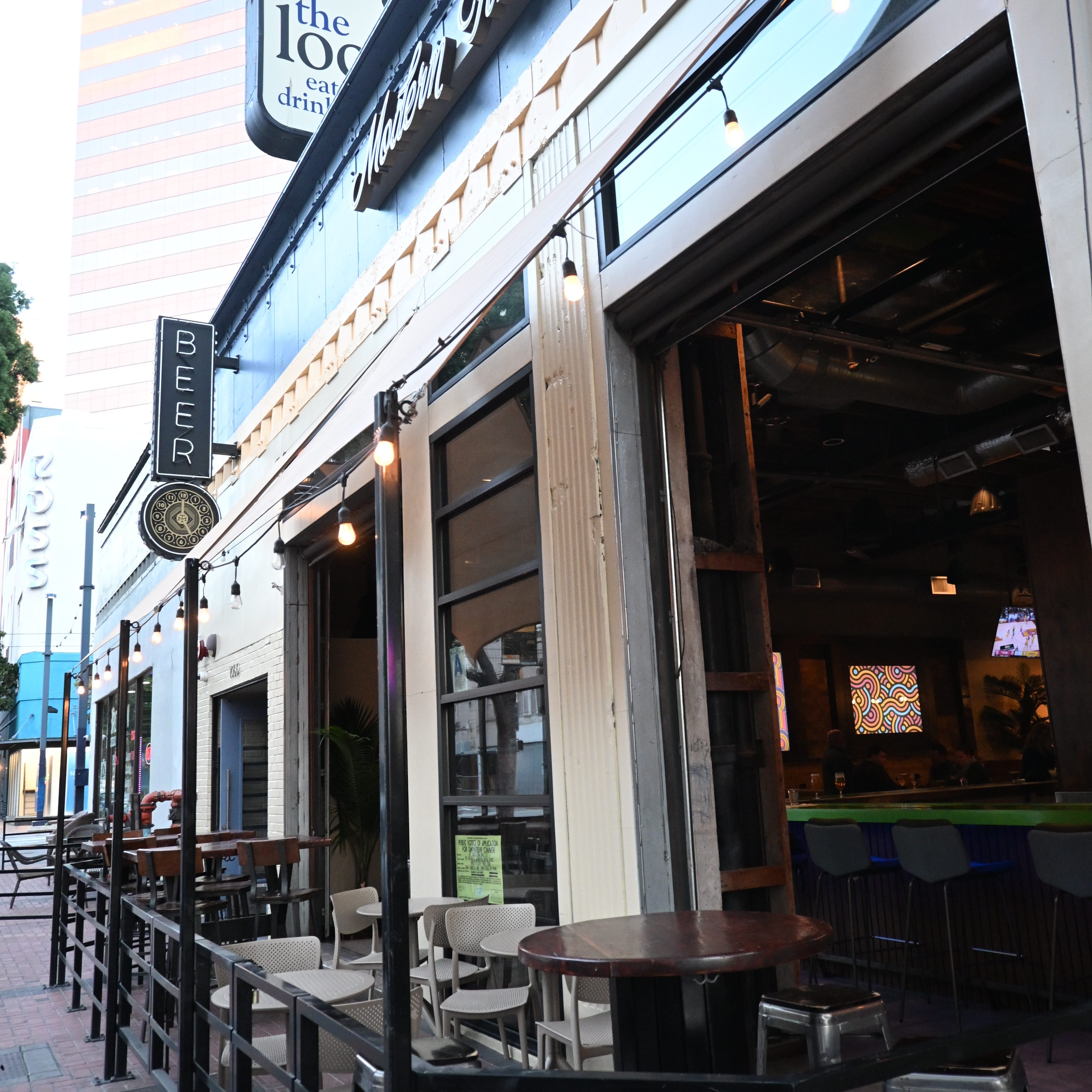 patio portrait - shows the local sign